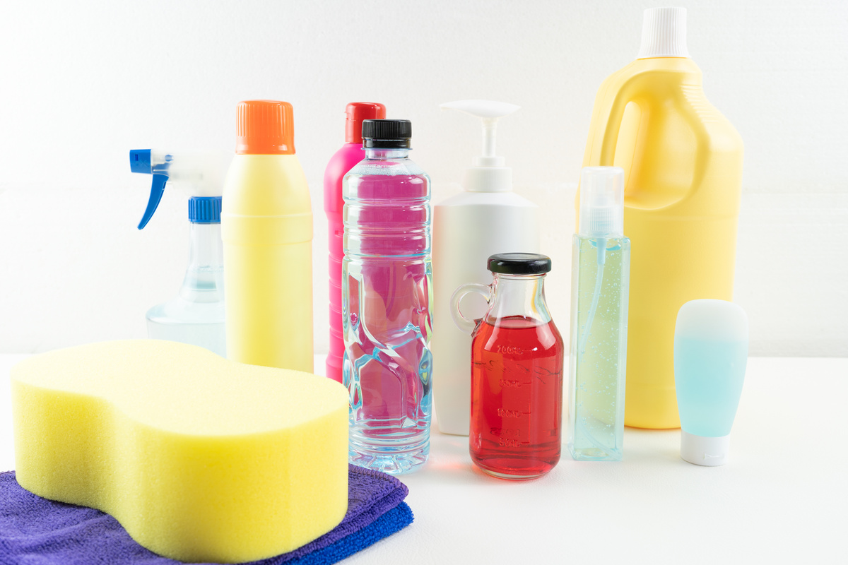 Sponge, Towels and Plastic Bottles of Cleaning Products
